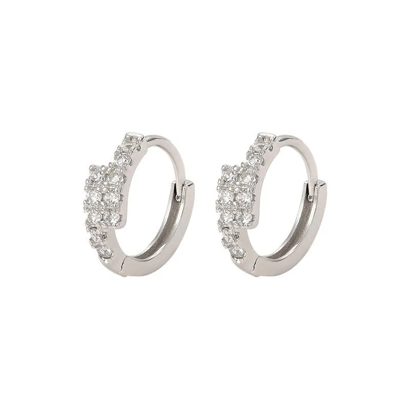 Small diamond ear clip earrings in white gold colour copper with geometric ring design, one pair
