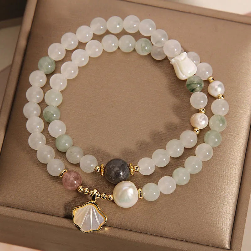 Tianshan emerald green crystal bracelet with gold-plated ginkgo leaf pendant and rhinestone accents