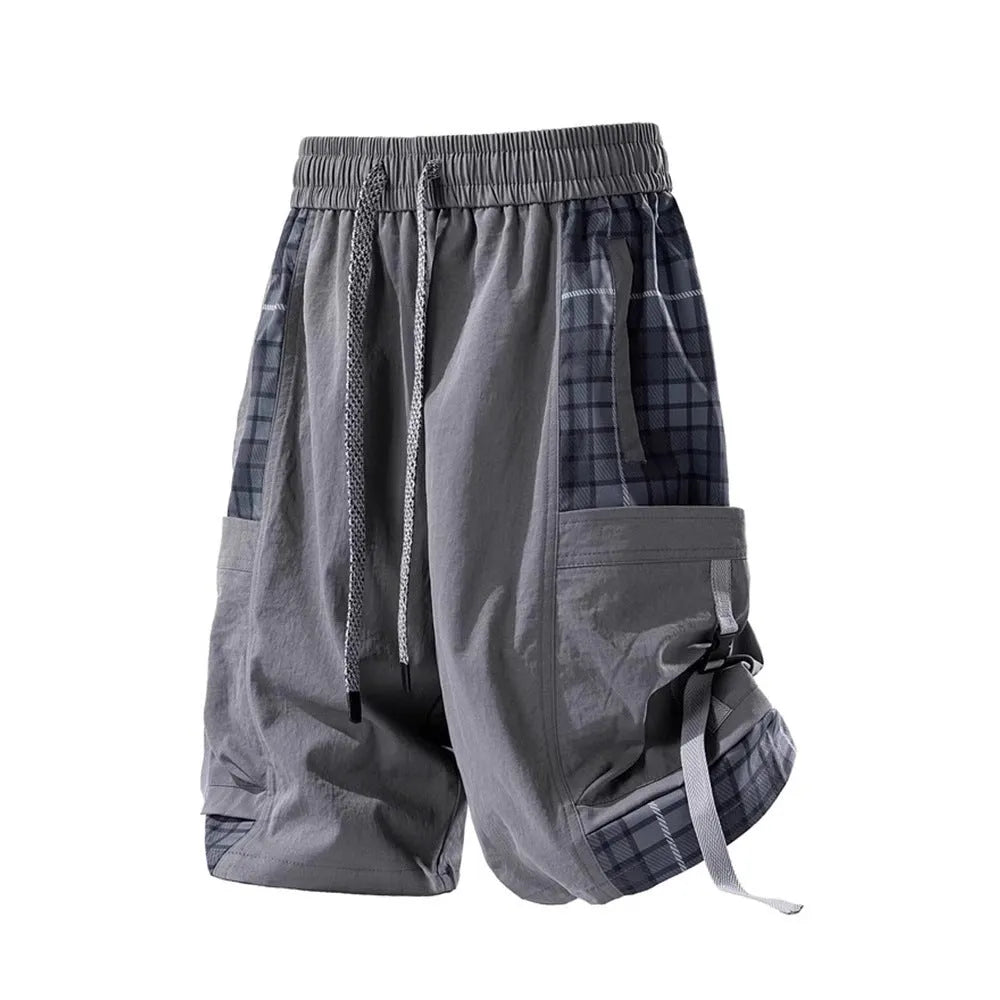 Men's black loose-fit cargo shorts with plaid stitching on the legs