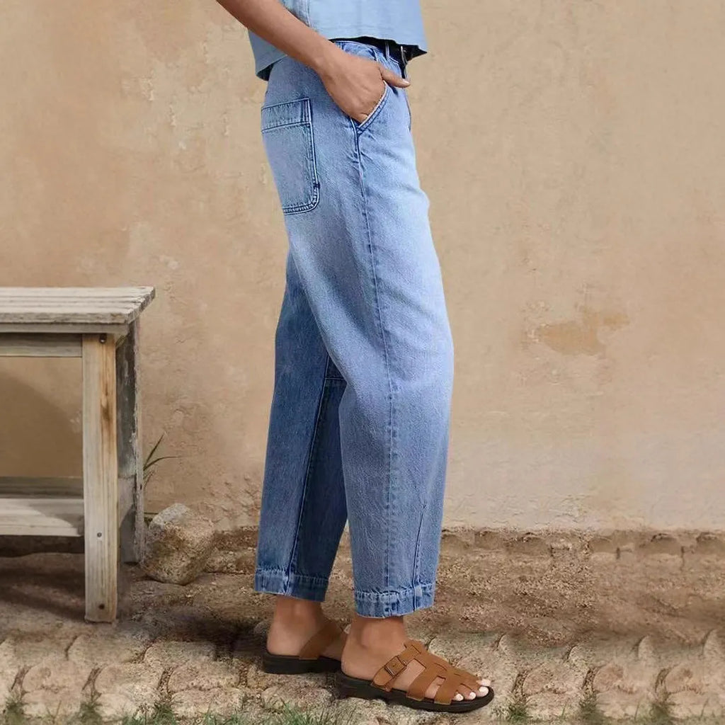 Casual cotton denim loose jeans trousers in light blue with washed finish, street hipster style