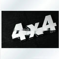 Metal 4x4 rear car badge in silver plated or black, 9cm x 3.5cm, for off-road vehicle use.