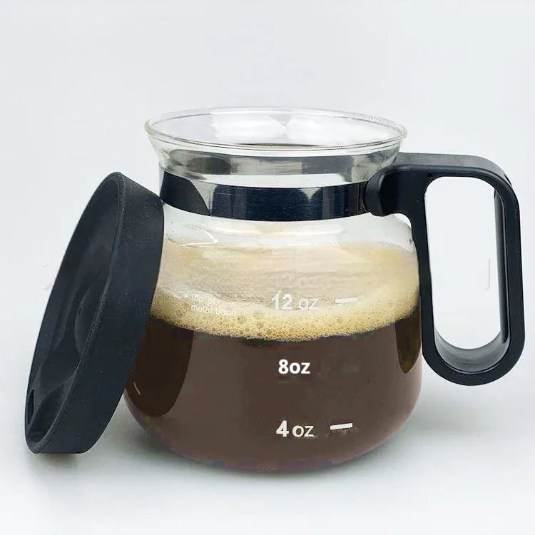 Transparent borosilicate glass coffee maker with silicone cover showing modern simple design