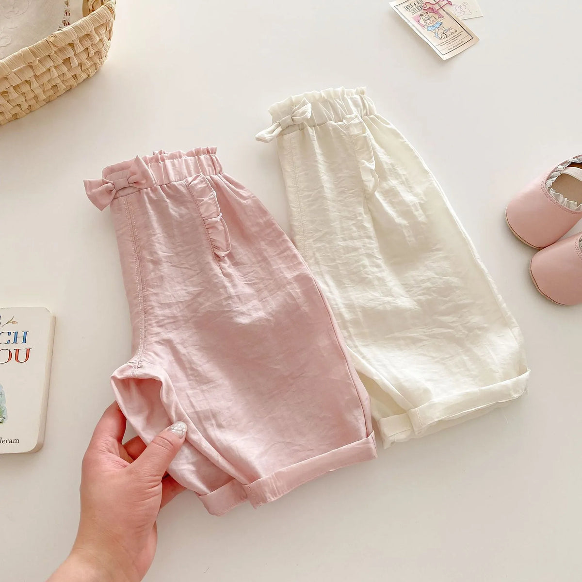 Girls' bow anti mosquito pants in cotton, solid colour, mid waist, available in rubber pink and cream beige, heights 73-120cm.
