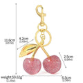 Red zinc alloy keychain with three-dimensional cherry pendant design for car keys and handbags