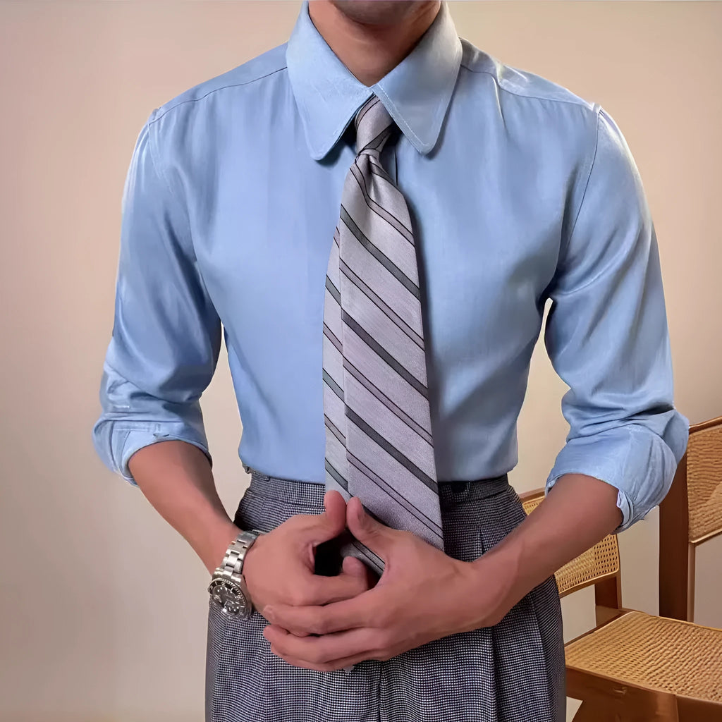 Men's slim fit long sleeve round collar shirt in a light blue colour, showcasing the button front and cuff detail.