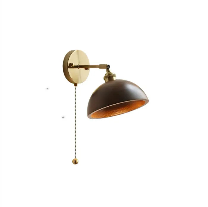 Nordic style wood finish wall lamp mounted beside a bed.