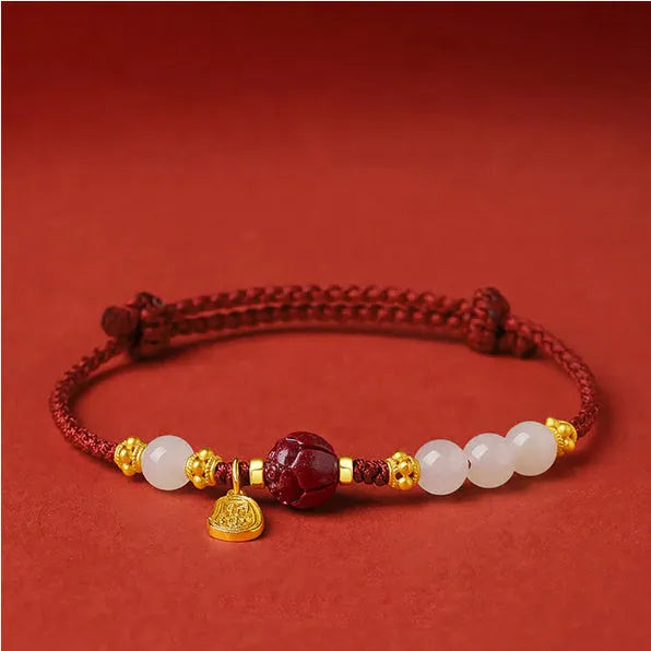 Adjustable women's bracelet with Hetian jade, cinnabar red rope, and 925 silver components