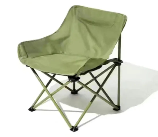 Beige portable folding camping chair with steel frame on grass outdoors