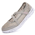 Women's flat lace-up casual shoes with mesh upper in beige, shown from the side.