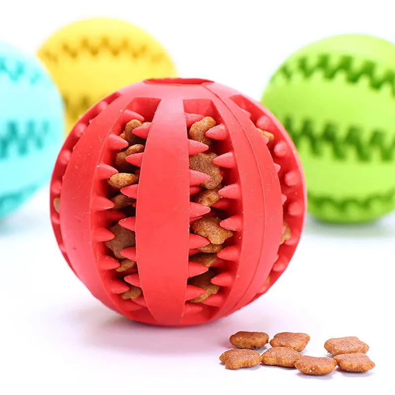 Small pink rubber pet dog toy self-hi relieving stuffy molars chew toy 5cm diameter on white background