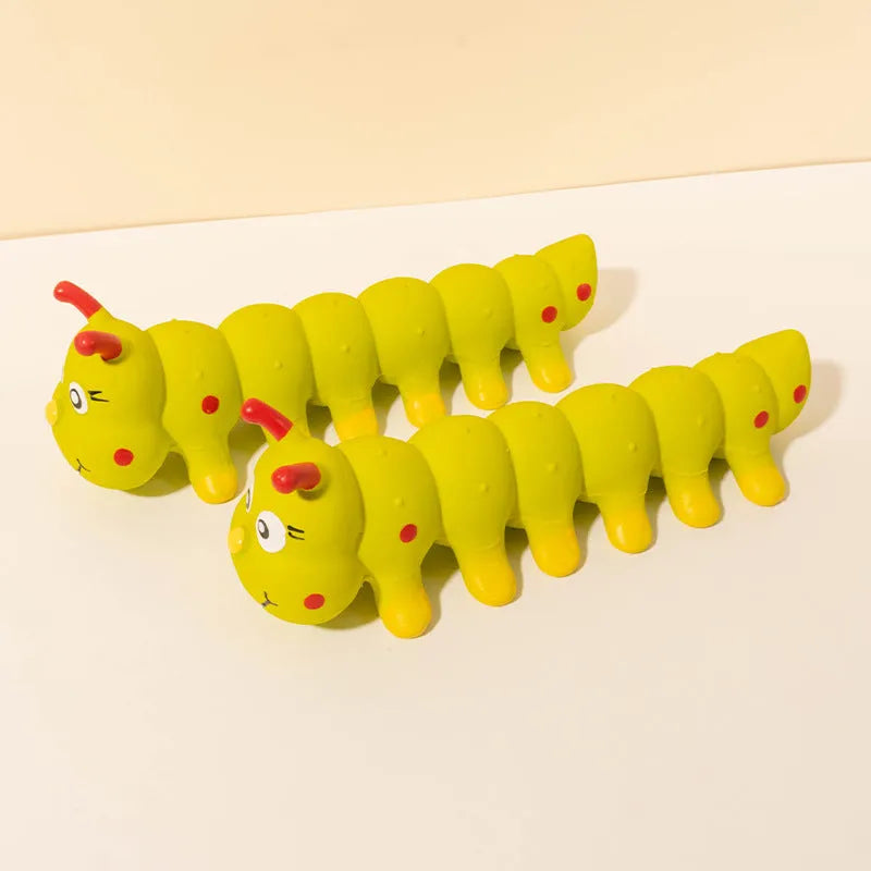 Yellow caterpillar-shaped rubber dog chew toy with squeaker for small medium dogs