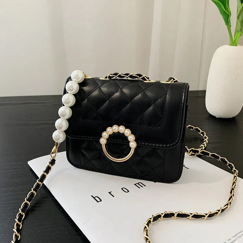 Diamond chain shoulder crossbody bag in soft PU with three-dimensional pocket design, shown in blue, black, beige and cream options