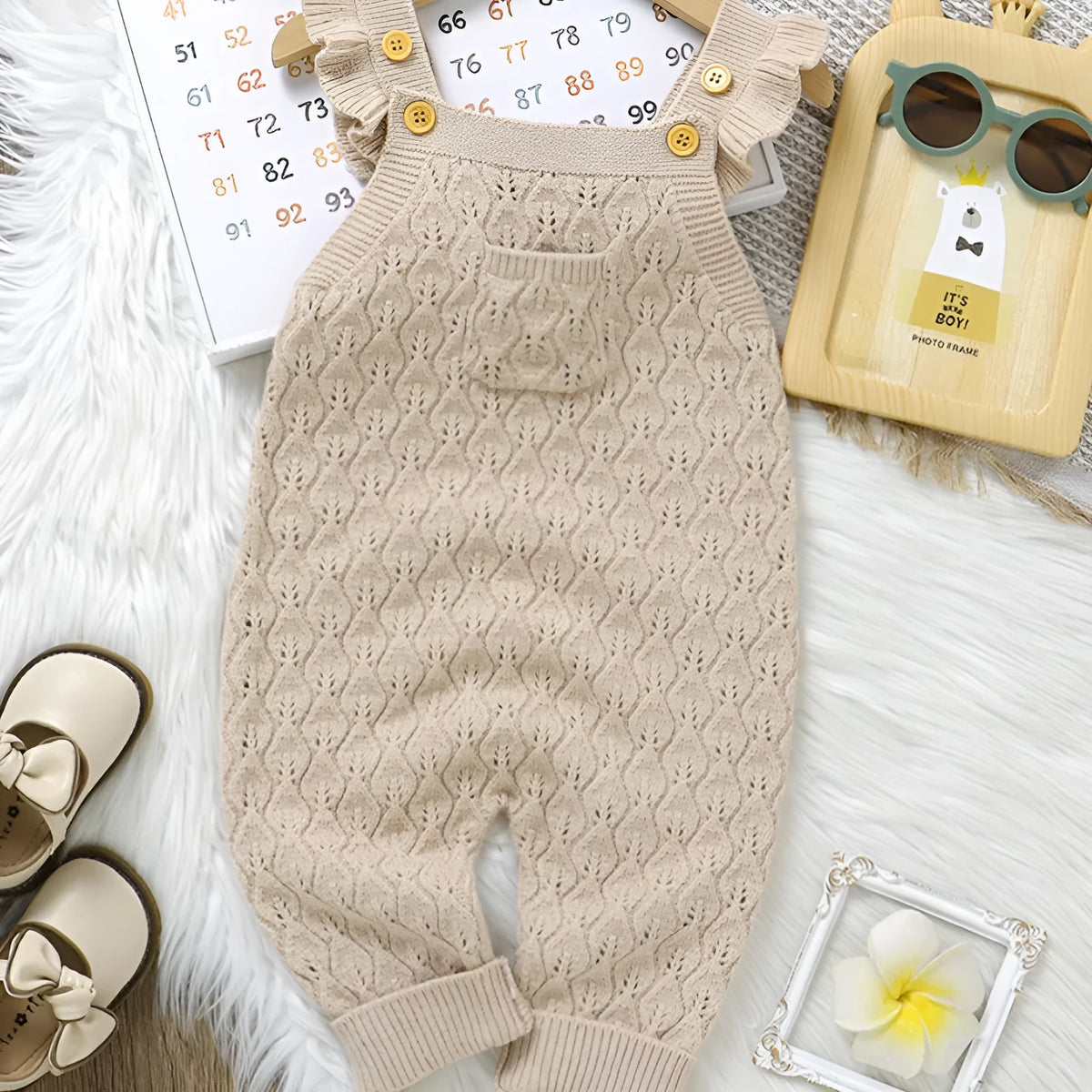 Infant sleeveless knitted romper jumpsuit with double-breasted closure and flounced sleeves in apricot