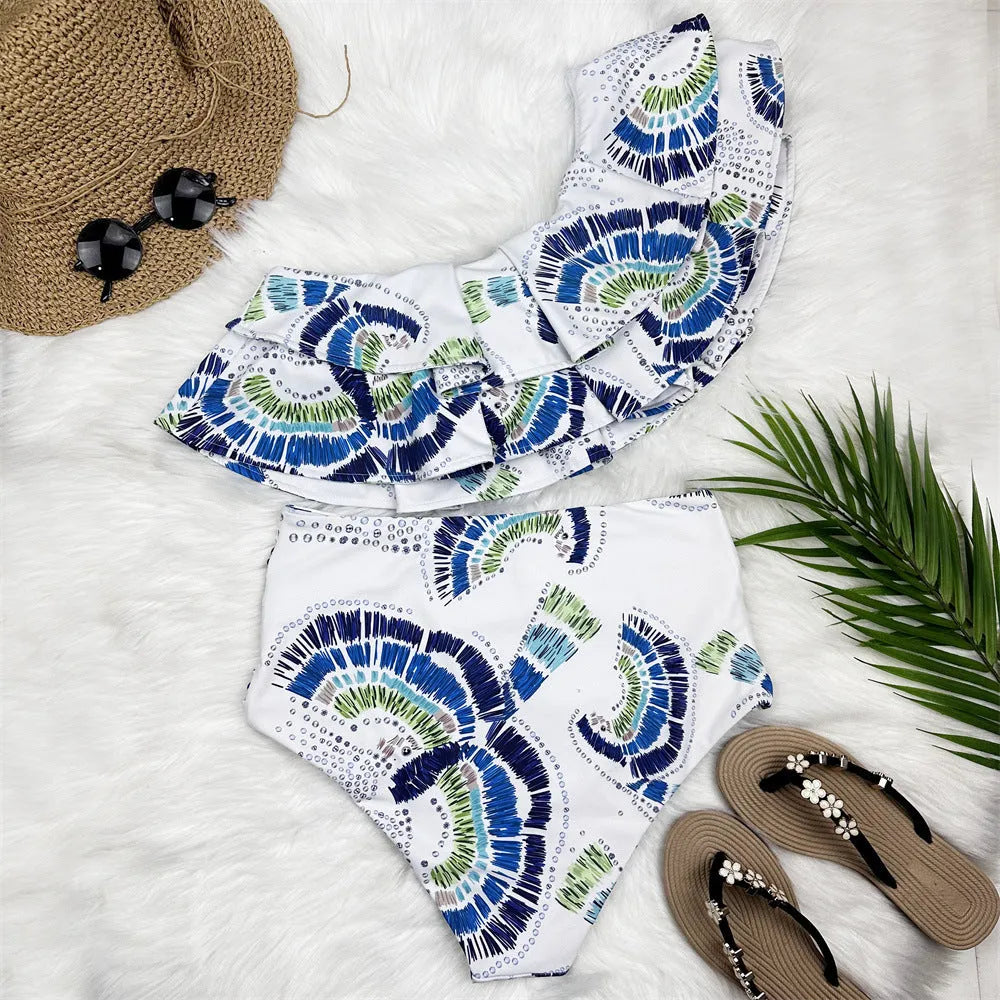 White one-shoulder swimsuit with double-layer lotus leaf skirt and high-leg split design