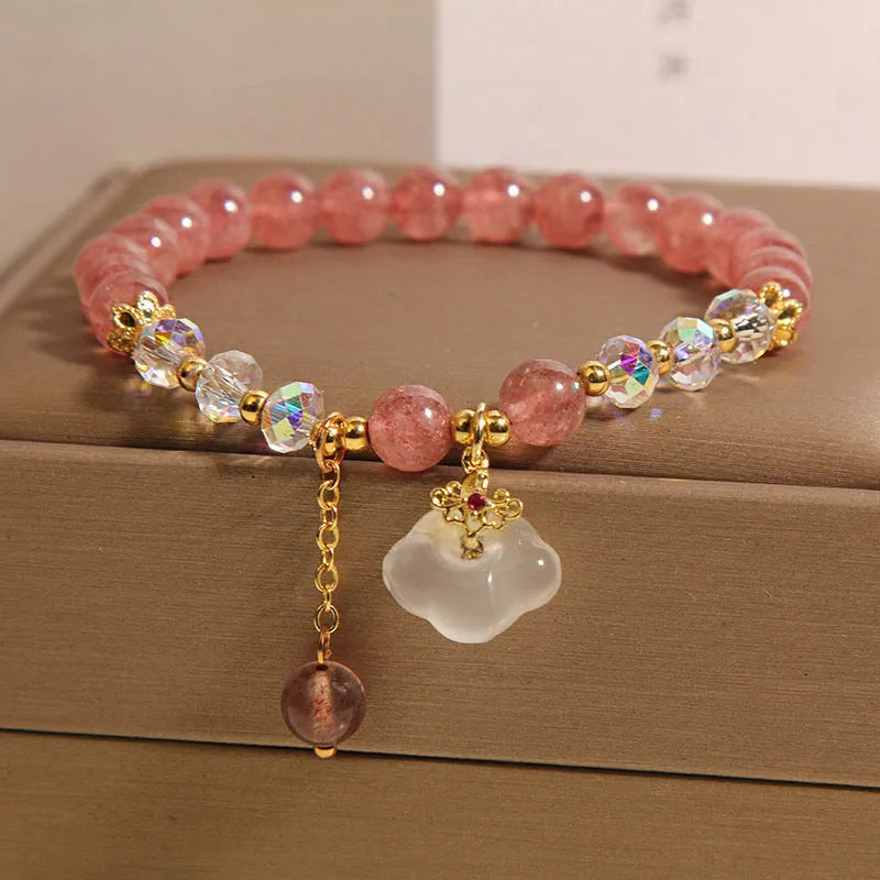 Women's natural crystal bracelet with strawberry quartz and white agate beads featuring auspicious cloud design