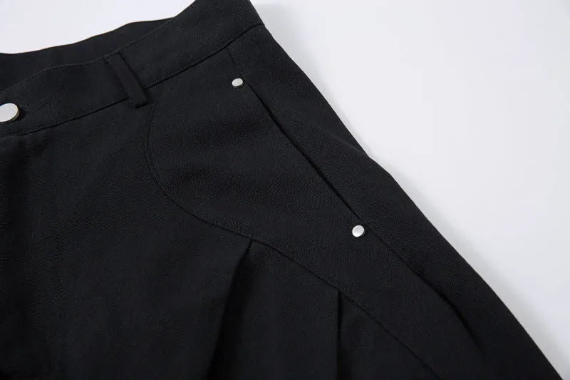 Men's black cotton pleated machete trousers with wide legs and elastic mid waist