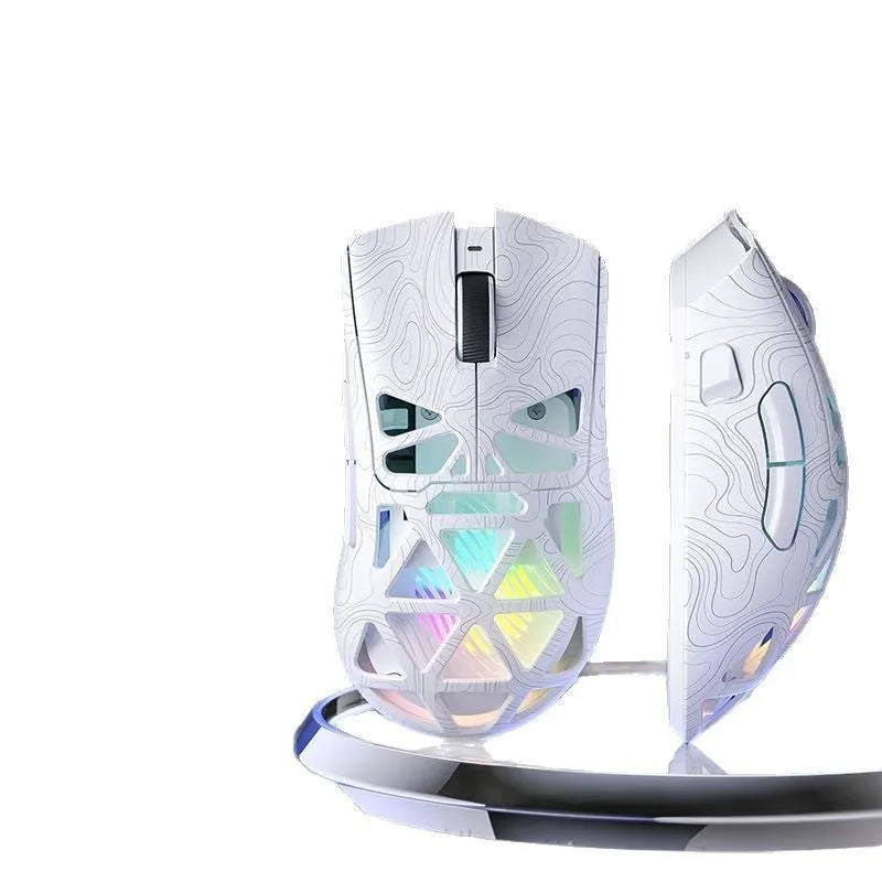 Wireless three-mode mouse with hollowed-out design in black contour finish on desk with cable