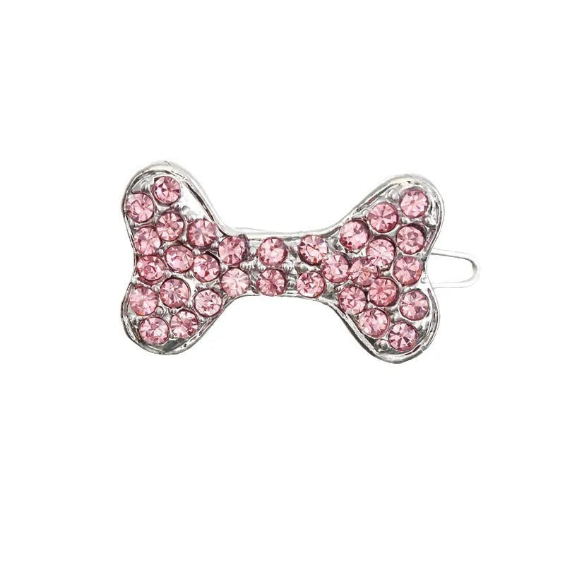 Rhinestone dog bone hair clip in alloy, shown in white, pink, blue, red and purple colour options.