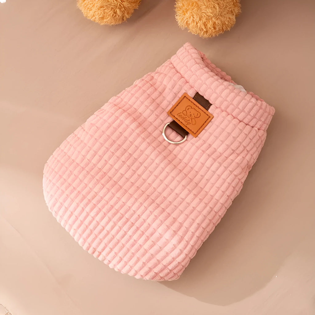 Pink corduroy dog vest with metal leash ring, cotton lining, and bear emblem tag, for small and medium dogs
