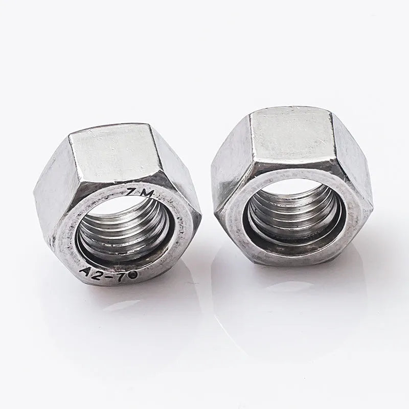 304 stainless steel thickened hexagon nut set with sizes from M5 to M56 on a workbench