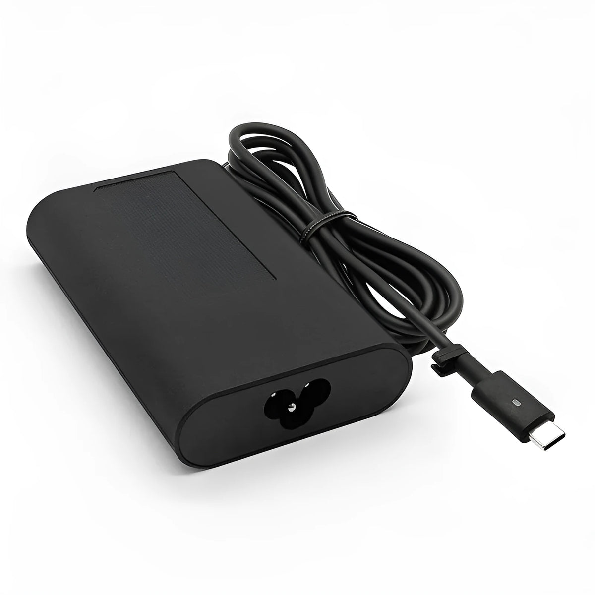 Black 65W USB-C laptop power adapter with UK plug and international travel adapters