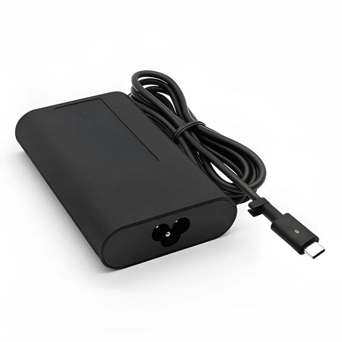 Black 65W USB-C laptop power adapter with UK plug and international travel adapters