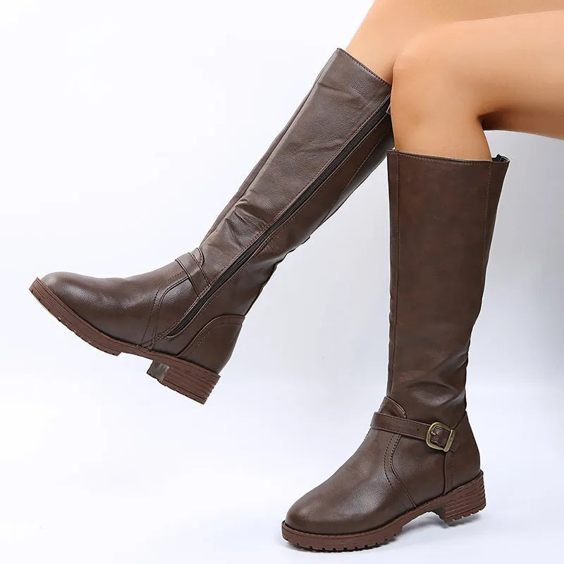 Yellow women's knight boots with a square heel, round toe, and buckle detail on a high calf shaft.