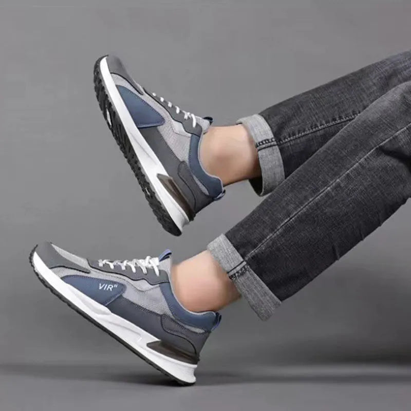 Men's colour block mesh sneakers in black, grey, or white with lace-up design and round toe.