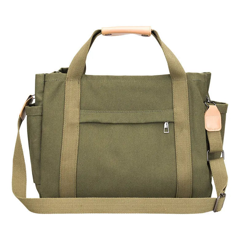 Canvas crossbody tote bag in khaki with open zipper showing internal organiser pockets.