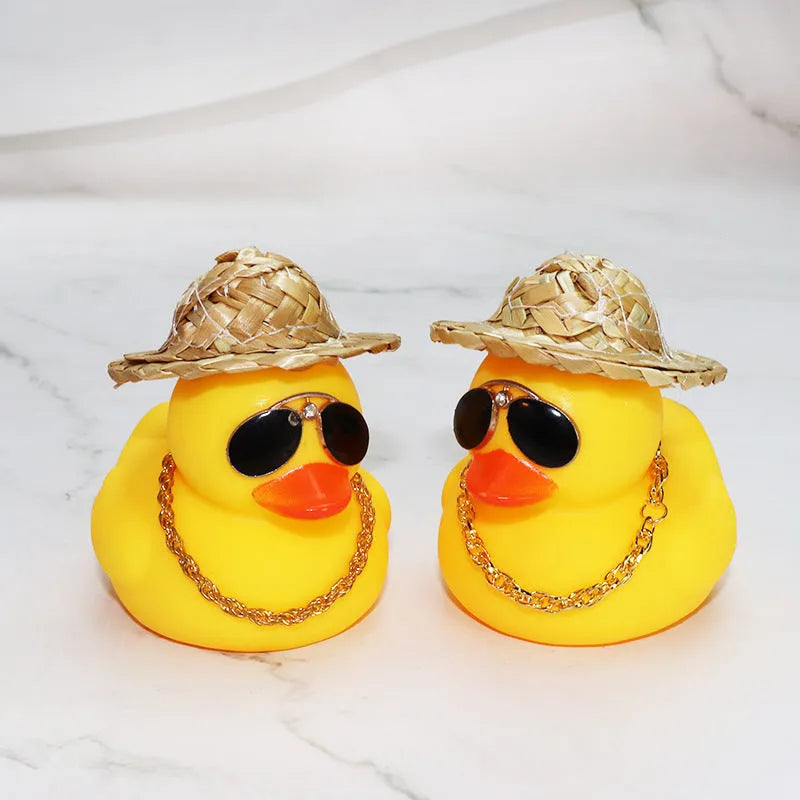 Yellow cartoon duck car ornament with straw hat and metal sunglasses for dashboard decoration
