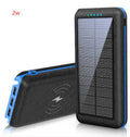 Black portable power bank with wireless Qi charging pad, three USB ports, and LED flashlight for iPhone Samsung Xiaomi phones