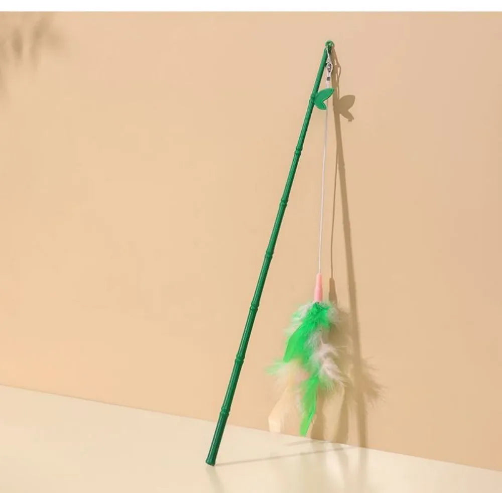 Green interactive cat feather wand toy with bell and feather attachments