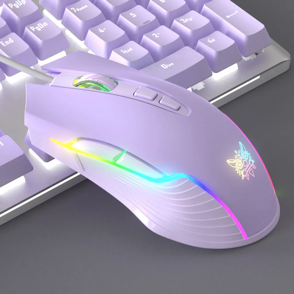 Purple and white mechanical keyboard and mouse set with matching headphones on desk