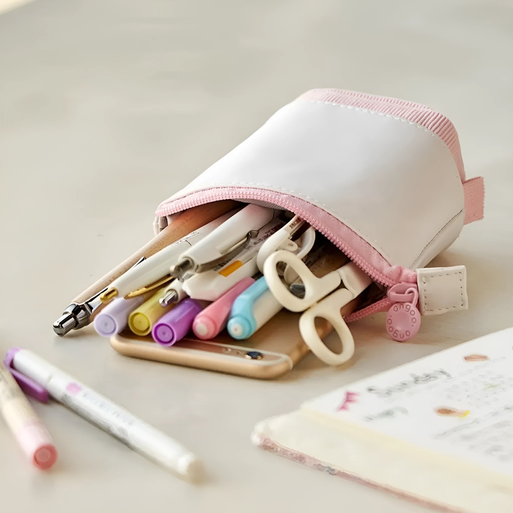 Corduroy telescopic stationery case shown expanded and collapsed in multiple colour options.