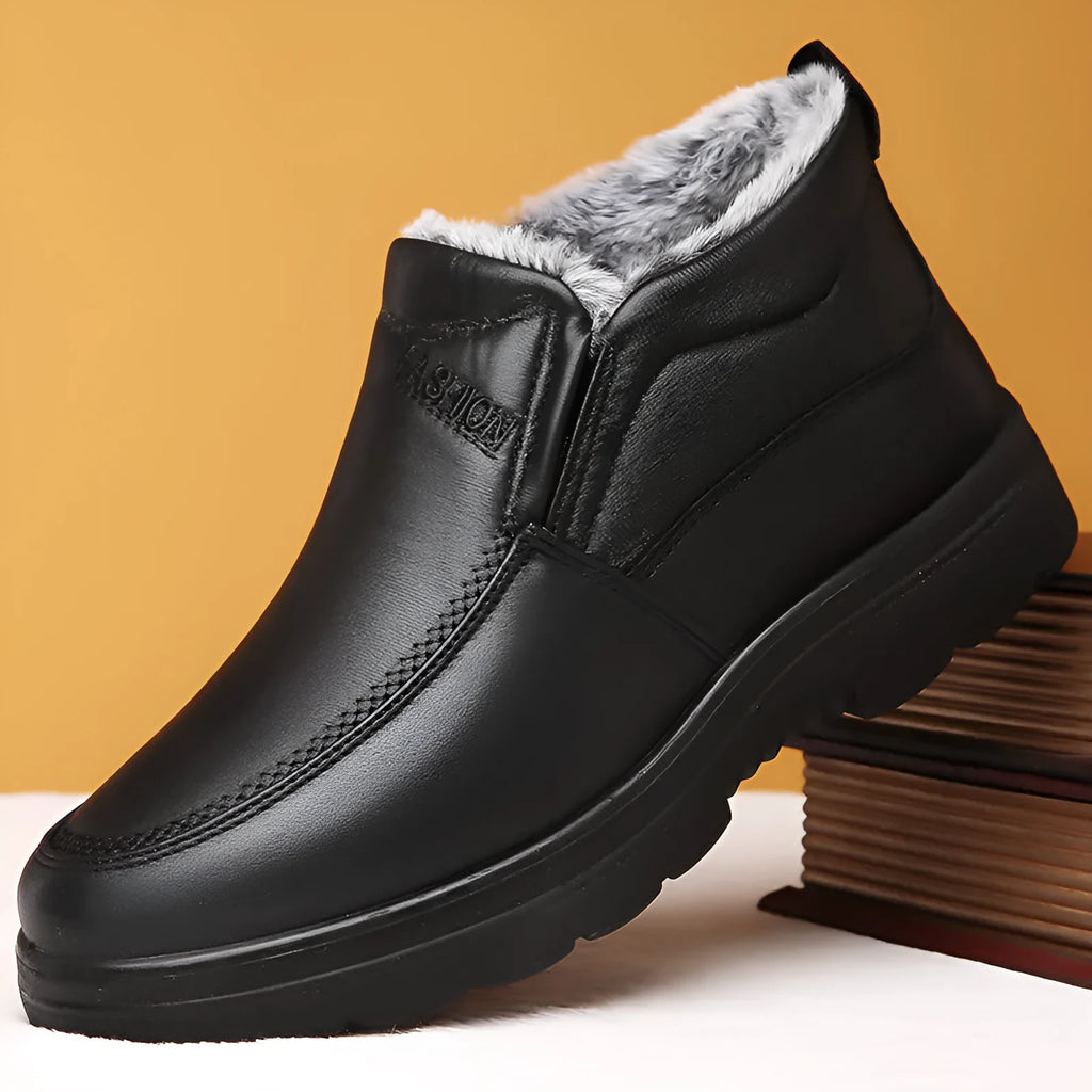 Men's black fleece-lined winter slip-on shoe with a non-slip rubber sole, shown on a size 45 foot.