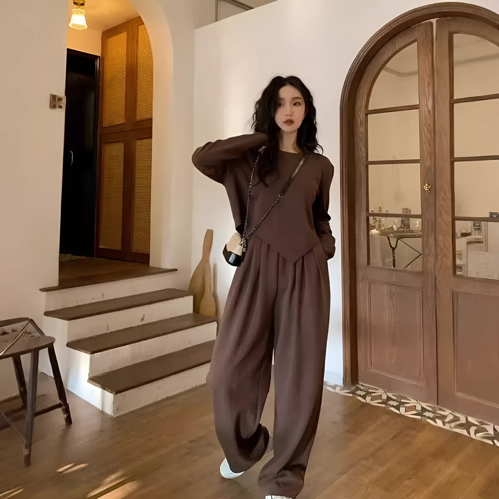 Women's khaki loose-fit casual sportswear set with long sleeve top and trousers on a hanger.