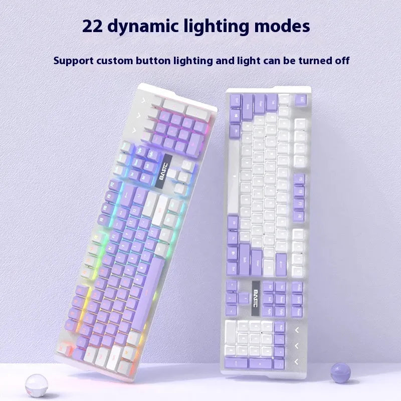 Purple and white mechanical keyboard and mouse set with matching headphones on desk