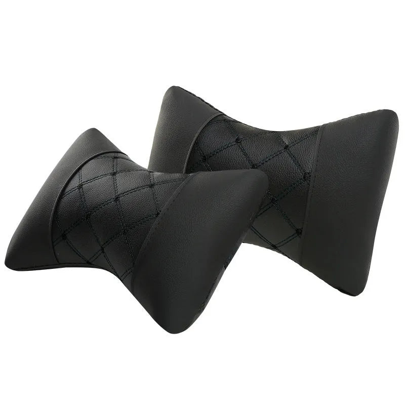 Black quilted car headrest cushion with diamond pattern for neck support.