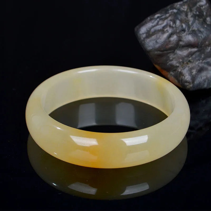 Traditional Chinese jade bracelet with polished finish in multiple sizes from 54mm to 62mm