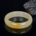 Traditional Chinese jade bracelet with polished finish in multiple sizes from 54mm to 62mm