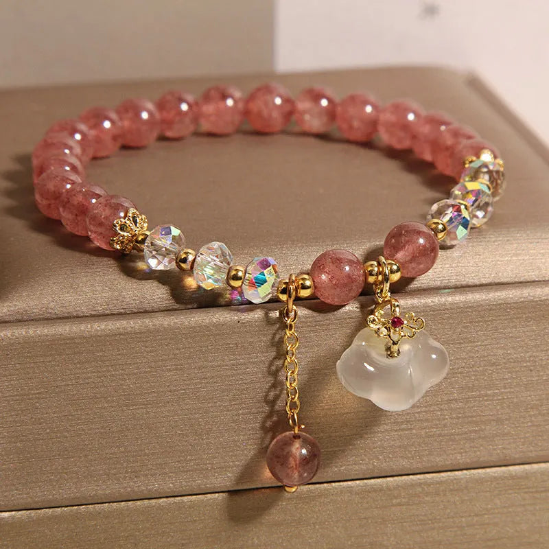 Women's natural crystal bracelet with strawberry quartz and white agate beads featuring auspicious cloud design