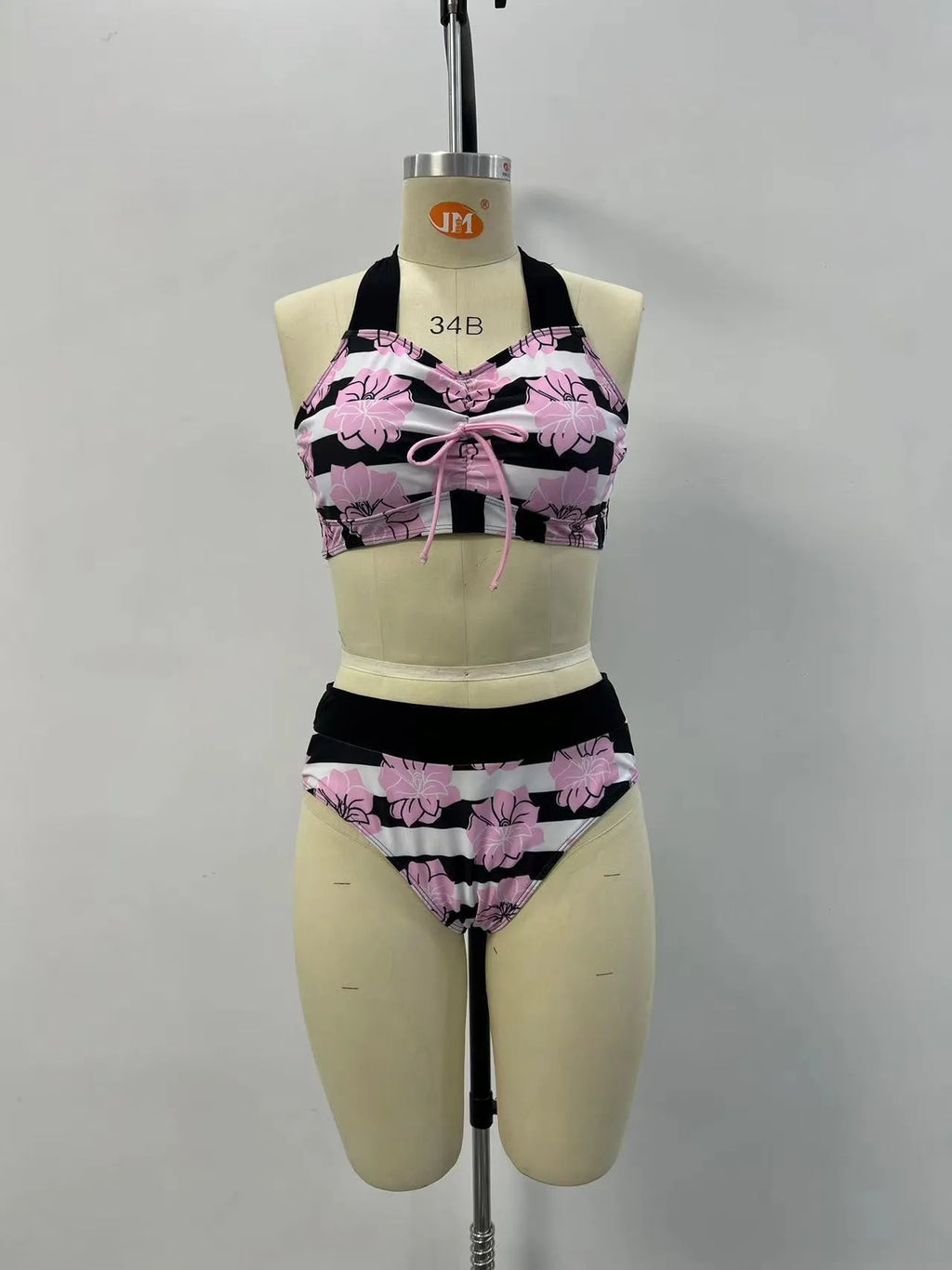 Black women's bikini with covered belly and split style for swimming.
