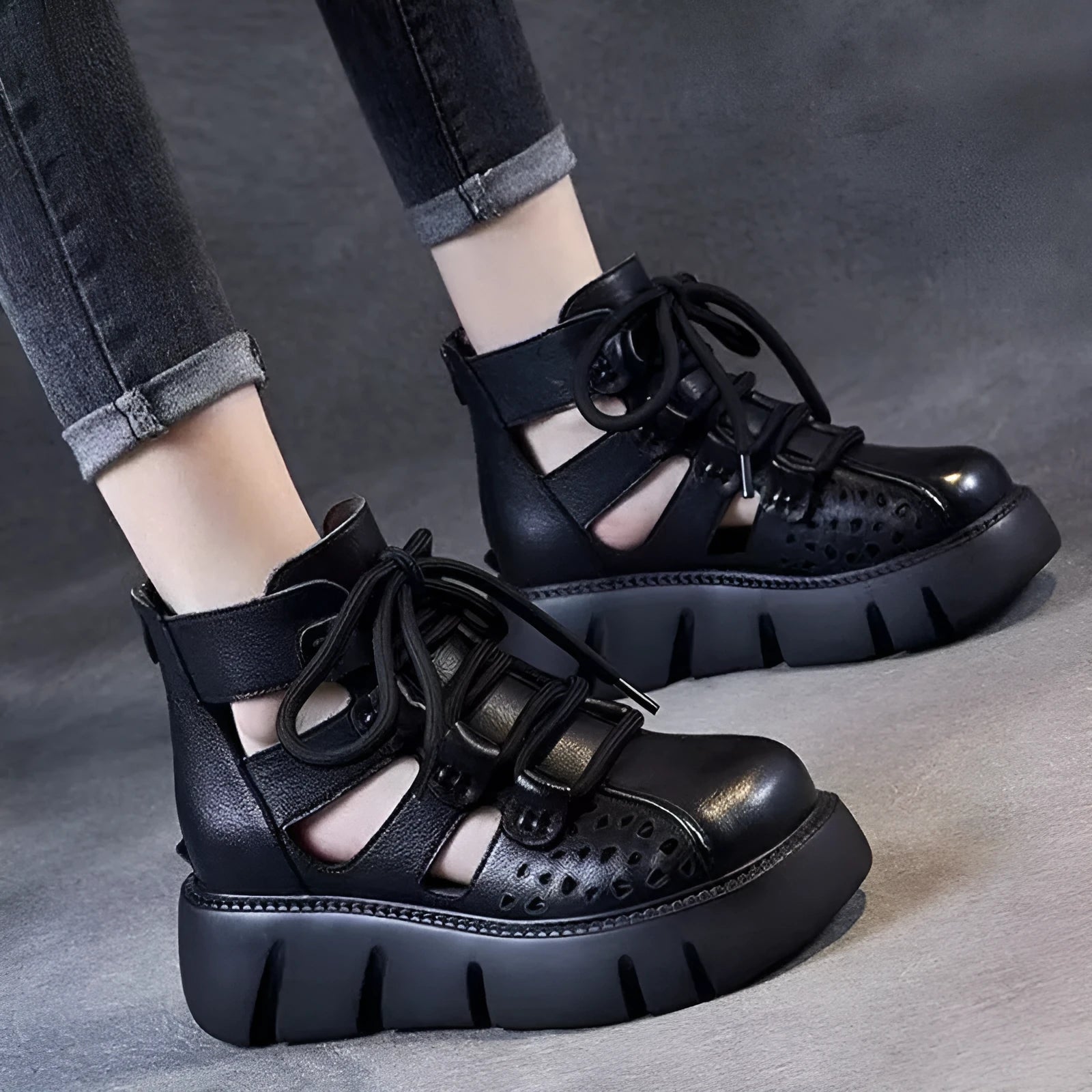 Women's black platform sandals with a hollow hole design and fish mouth toe, made from soft cowhide leather with a PU sole.