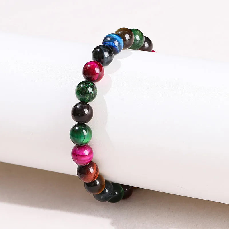 Colourful tiger-eye stone beaded bracelet with round beads on a cord, showing size options.