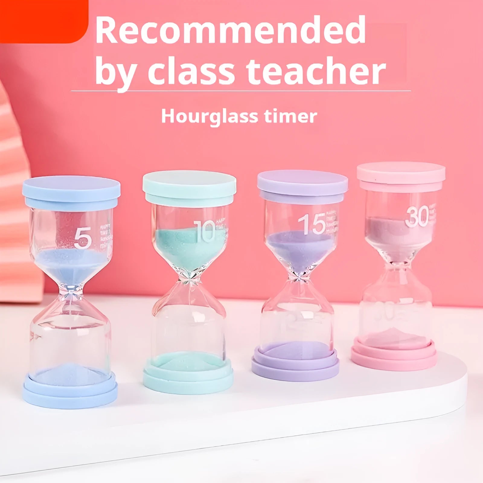 Handmade glass sand timer in blue on a wooden desk, showing sand flowing through the centre.