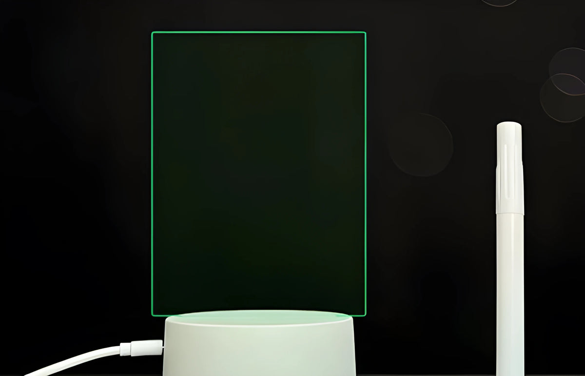 3D acrylic LED message board night light on a desk, showing illuminated surface and remote control