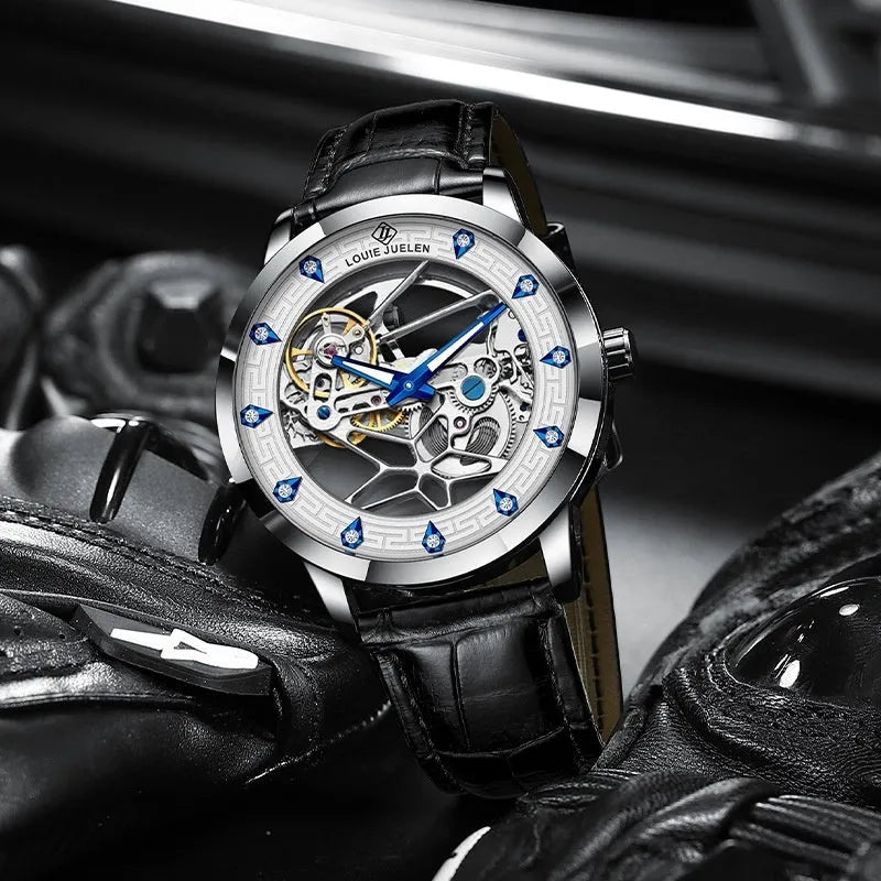 Men's silver case mechanical watch with white dial, blue hands, and black leather strap