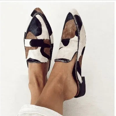Women's black and white apricot animal print retro shoes with pointed toe and low heel.