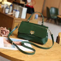 Women's brown leather saddleback handbag with double straps and multiple compartments