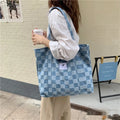 Women's large canvas shoulder bag in Oxford cloth with a three-dimensional front pocket, shown in various colours.
